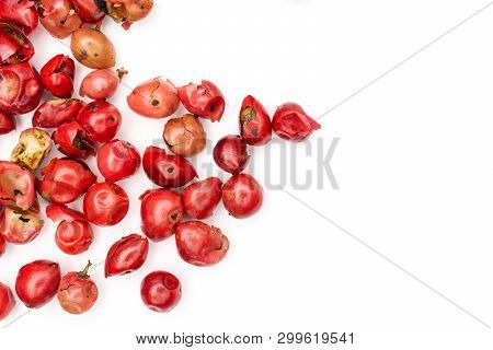Lot Of Whole Dry Peruvian Pink Pepper On The Left Side Flatlay Isolated On White Background