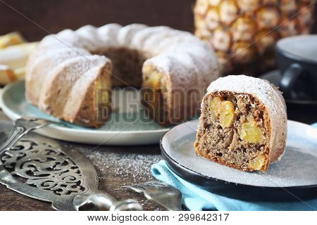 Homemade Pineapple Cake And Cup Of Caffee On Wooden Background
