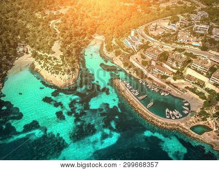 Beautiful birdeye view on the sea coastline with pier and yakhts at sunny day. Travell, jorney,islands, Seascape, freedom, holidays concept.