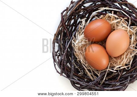 Easter! Chicken Eggs In A Nest With Branches, Agriculture.
Easter Eggs On The Table In The Nest.
Bei