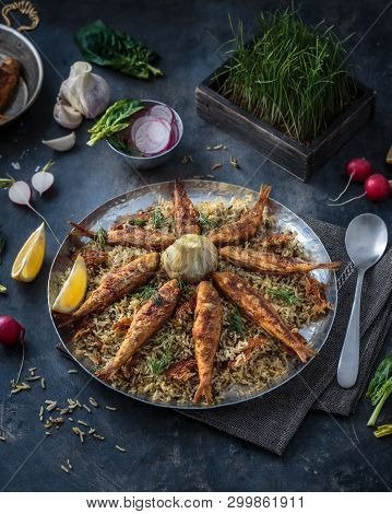 Rice Pilaf With Different Herbs And Fish. Persian Cuisine