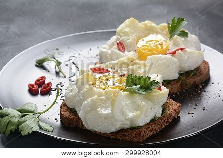 Delicate Baked Egg. Orsini Eggs In The Cloud. French Breakfast. Cloud Egg On Toast