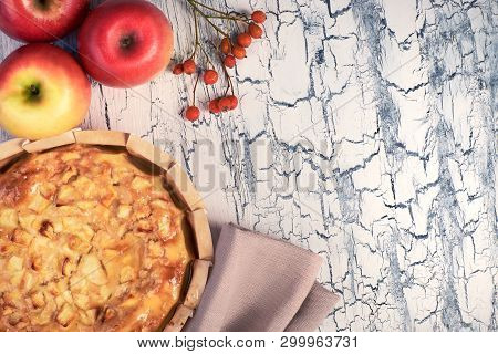 Homemade Apple Pie With Apples, Berries And Linen Napkin On Light Rustic Background.  Top View, Tone