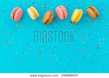 Brignt Macarons For Sweet Break On Blue Background Top View Mock Up