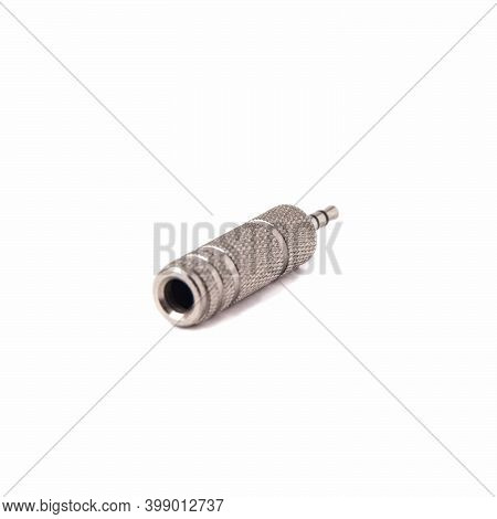 Metal Audio Jack To Mini Jack Adapter, Isolated On White Background. Close Up