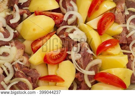 Pork Meat, Potatoes, Tomatoes And Onions, Ready To Bake
