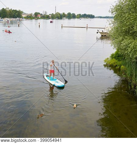 Werder, Germany - July 25: 2020: Stand-up Paddling On The River Havel Near Werder Seen From A Bridge