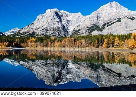 Rockies Reflected In Wedge Pond An A Crips Autumn Day. Spray Valley Provincial Park.