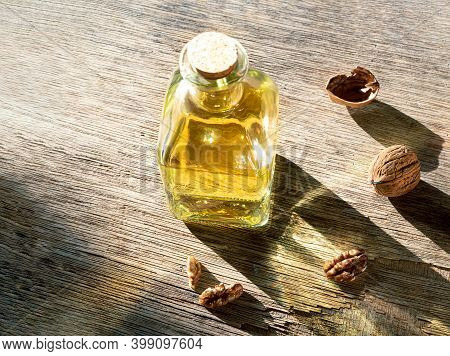 A Bottle Of Walnut Oil And Walnuts