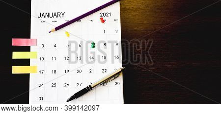 Close Up The Calendar On The Brown Table In Planning Ideas.