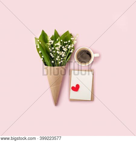 Bouquet Of Flowers And Cup Of Coffee And Mock Up Fpr Letter Message On Pink, Copy Space, Minimal Gre