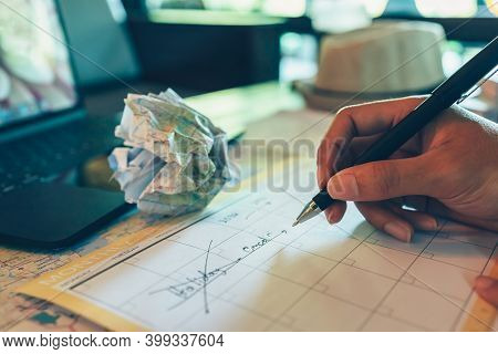 Tourist Hold Pen And Planning Vacation With Calendar And Map. Cross Line In Holiday Text And Crump P
