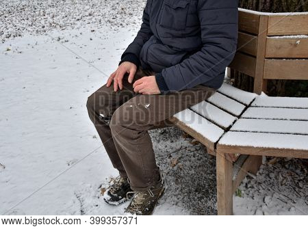 Homeless Man, Abandoned Lonely And Frail. When Spending The Night In A Park On A Snowy Circle Shape 