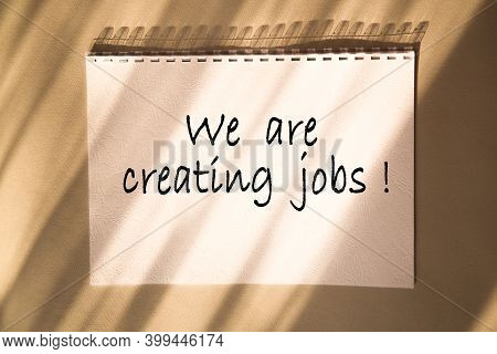 We Are Creating Jobs. Text On A Beautiful Background With Shadows. Business And Financial Conzept.