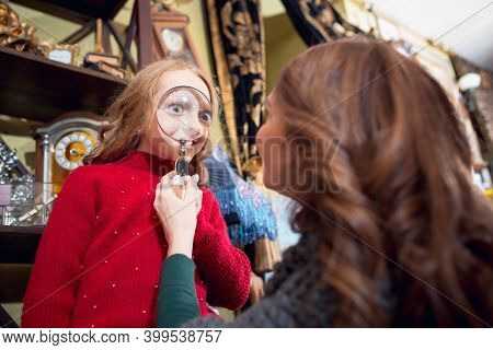 Having Fun. Cheerful Family, Mother And Kids Looking For Home Decoration And Holidays Gifts In House