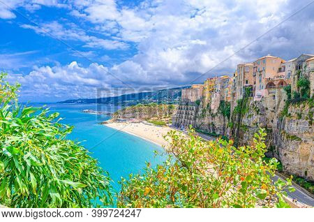 Tropea Town And Beach, Tyrrhenian Sea Turquoise Water, Colorful Buildings On Top Of High Big Rocks C