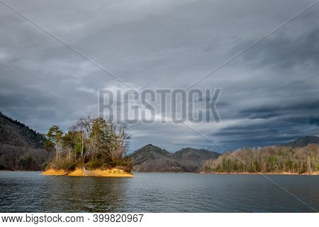 The Waning Sunshine Strikes An Island At Watauga Lake, Elizabethton, Tennessee.