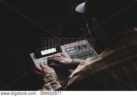 A Hip Hop Composer, Beatmaker Creates Beats On A Digital Production Controller With Pushbutton Pads.