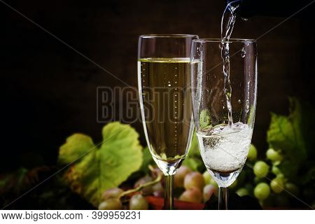 Champagne Pour In Glass, Grapes With Vine, Vintage Wood Background, Selective Focus