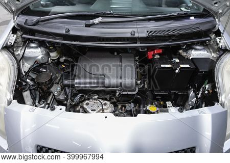 Novosibirsk, Russia - December 17, 2020:  Toyota Vitz, Under The Hood Of Car. Powerful Engine Closeu