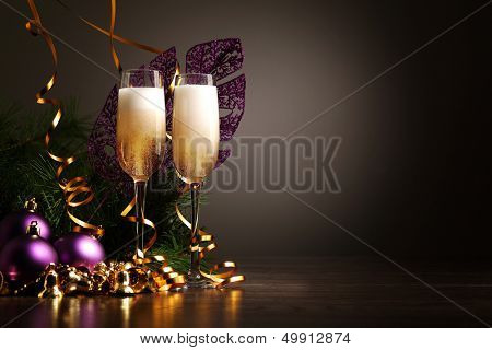 Two champagne glasses ready to bring in the New Year