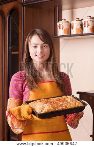 Beautiful Girl With Cake In Kitchen
