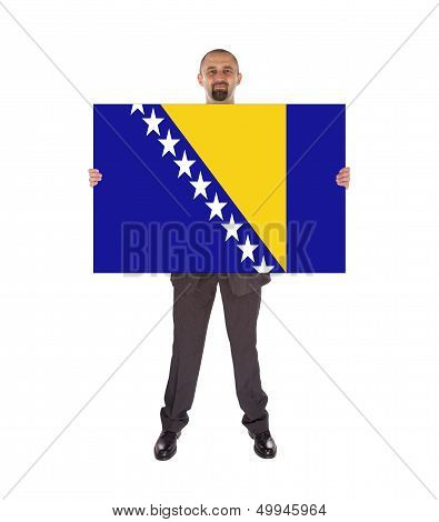Smiling Businessman Holding A Big Card, Flag Of Bosnia And Herzegovina