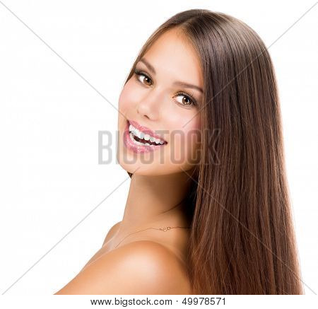 Beauty Girl Face. Beautiful Teenage Model Girl Portrait. Clean Fresh Skin and Long Hair. Brown Eyes and Hair. Looking at Camera 