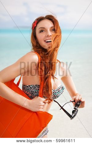 Redhair woman on beach