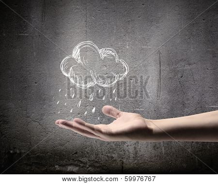 Background conceptual image with raining cloud in hand