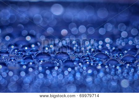 Water droplets on blue