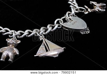 Silver charm bracelet.