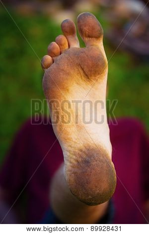 Dirty Foot Man On Green Background.