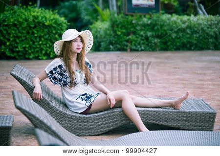 Beautiful Relex On Lounger Near Swimming Pool In Hotel, Krabi, Thailand