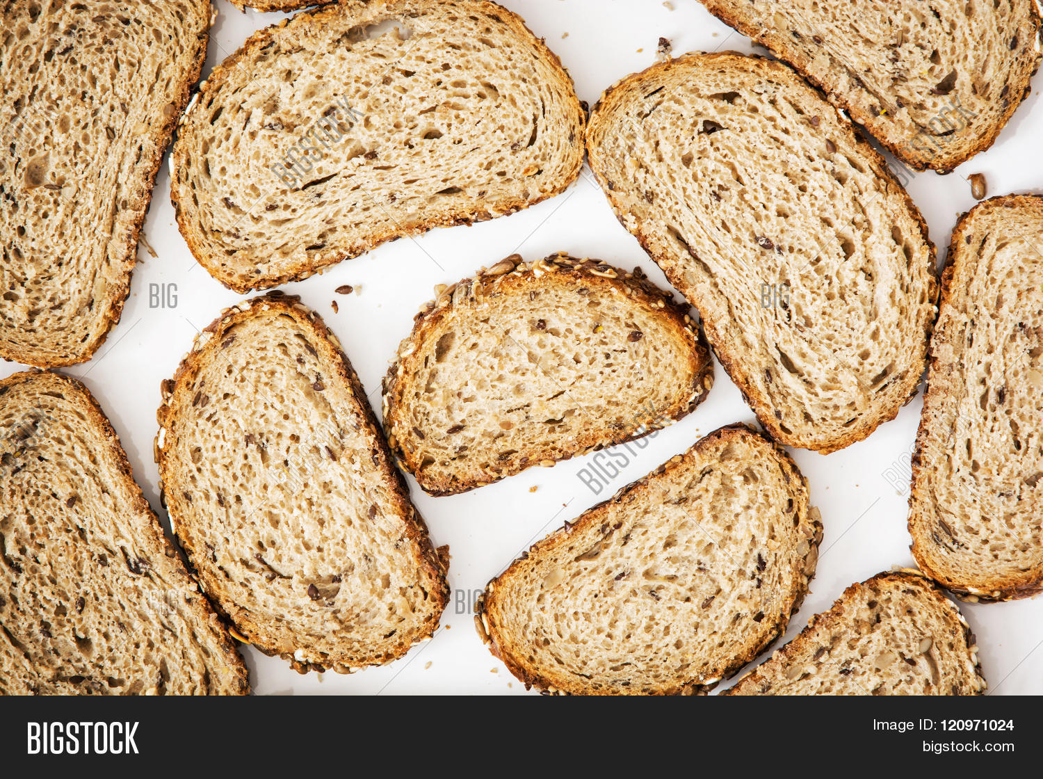 close up of sliced wheaten bread on the white plate. food theme.
