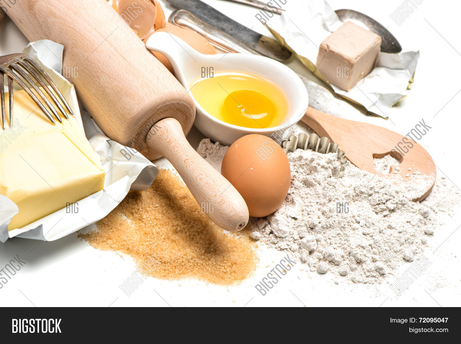 baking ingredients eggs flour sugar butter yeast.