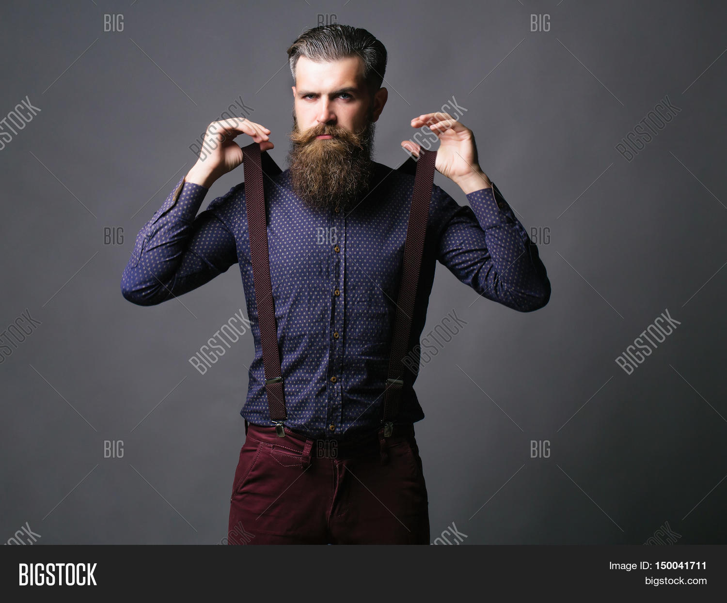 trendy man pulls suspenders 库存照片和库存图片 | bigstock