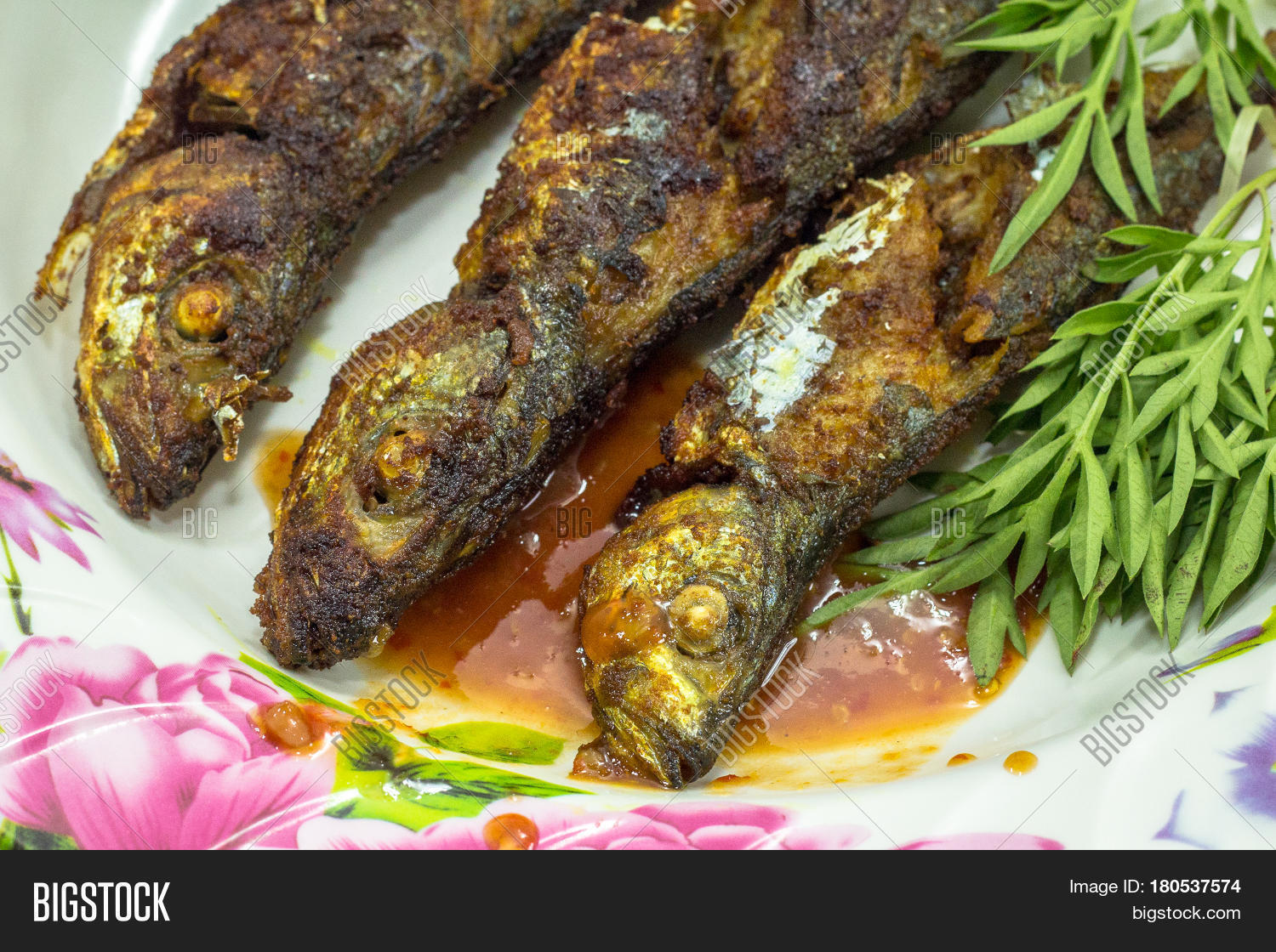 fried fish with sambal is a popular home-style dish in malaysia