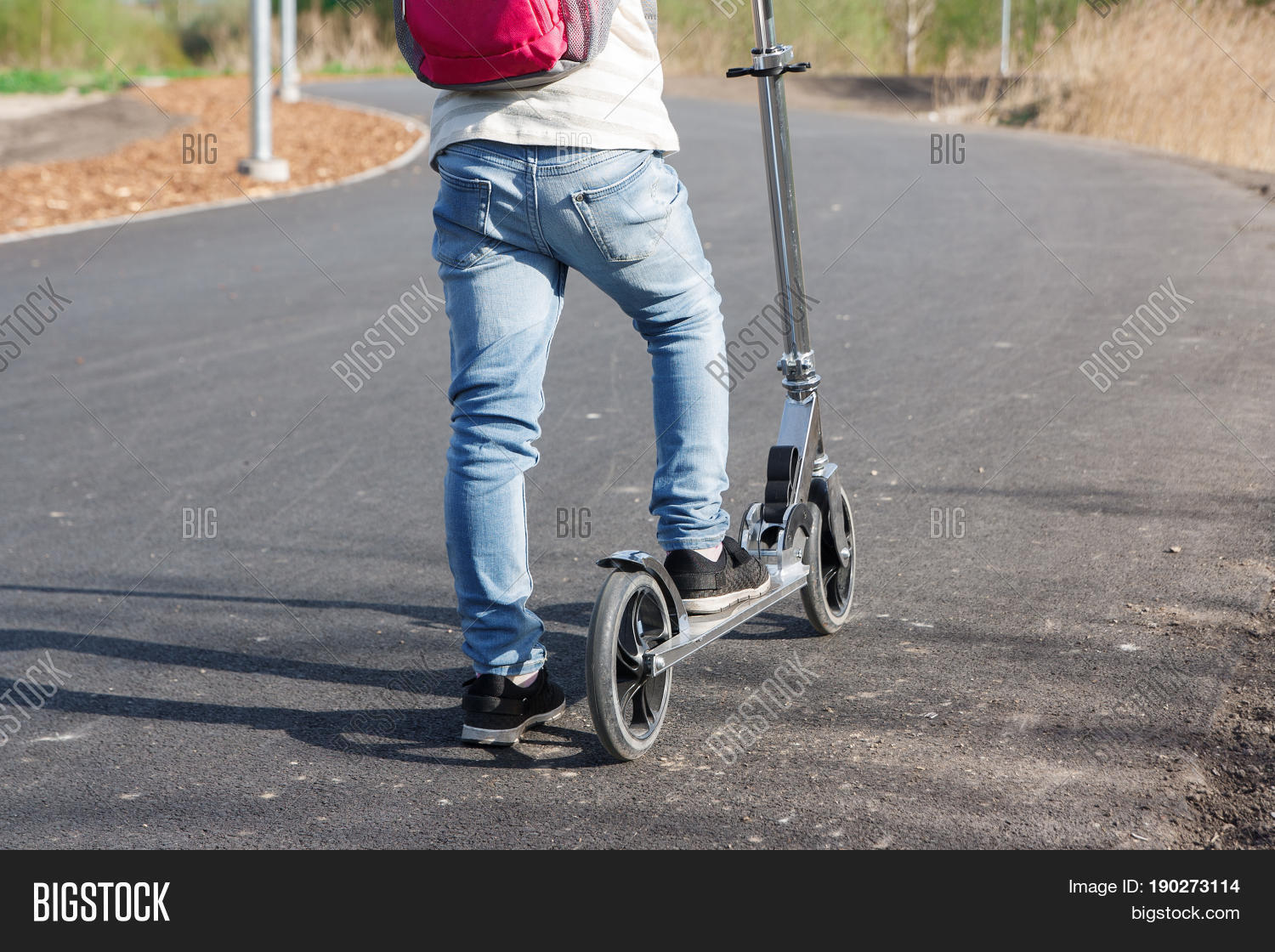 the child goes on a journey on the scooter.