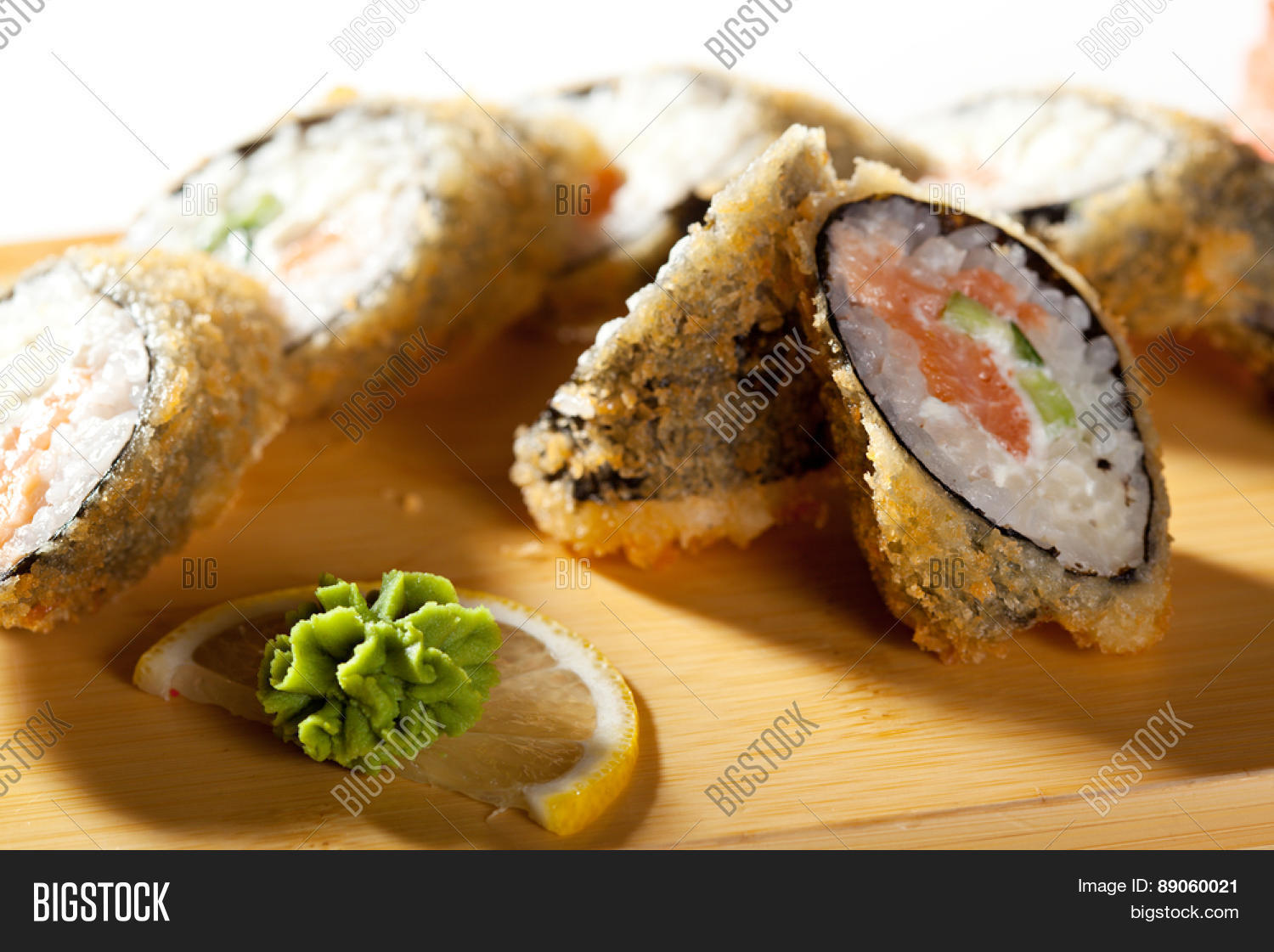 salmon fried maki sushi - hot roll with fresh salmon, cream