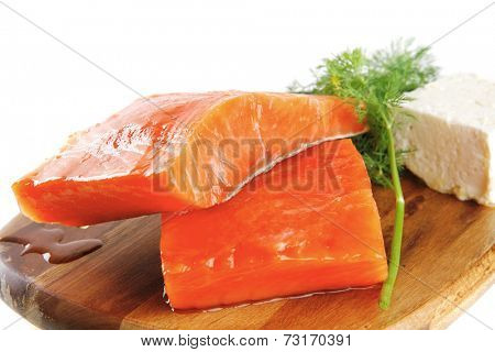 smoked pink salmon chunk with olives and white cheese