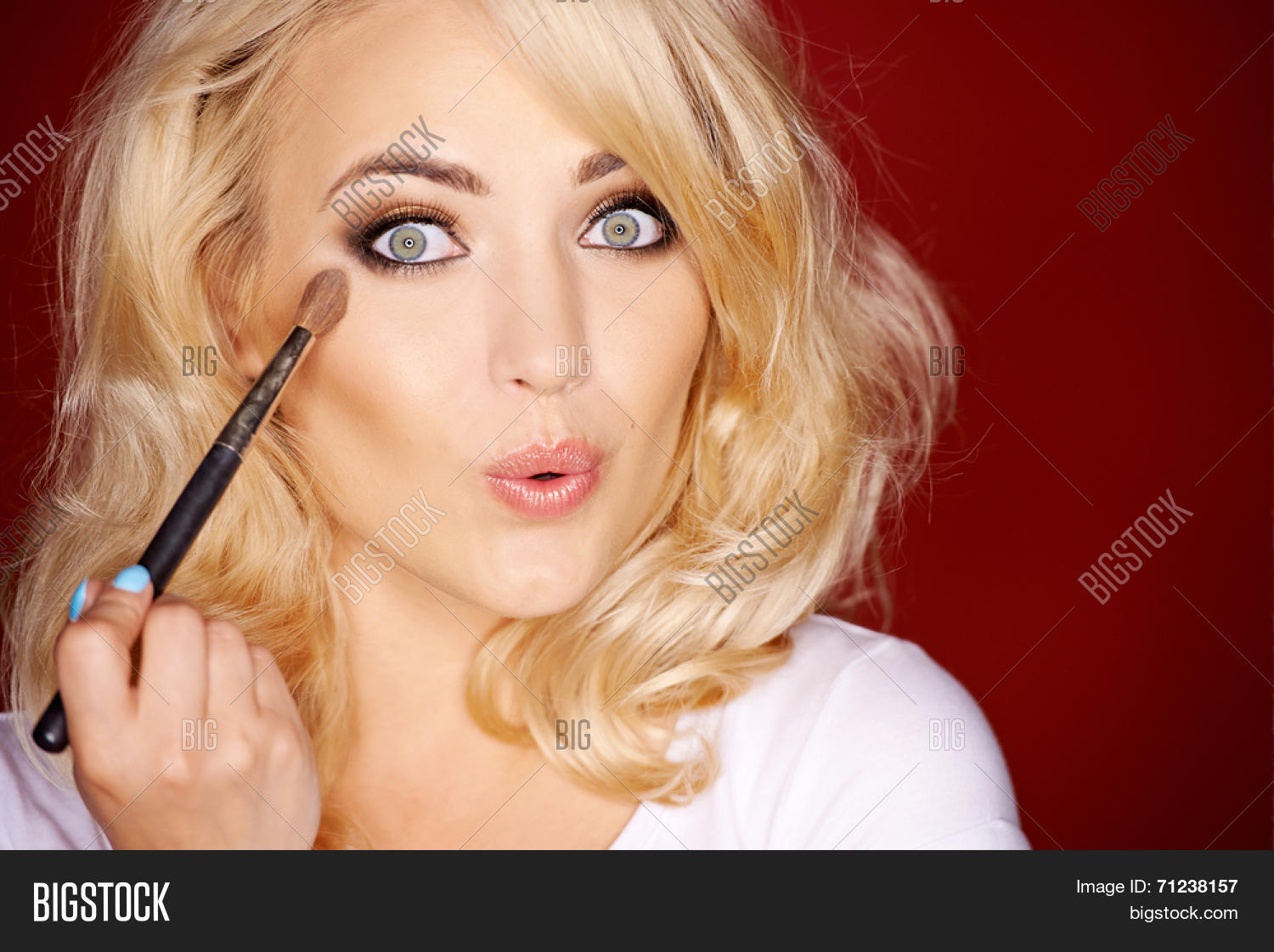 beautiful sexy woman pouting seductively at the camera as she