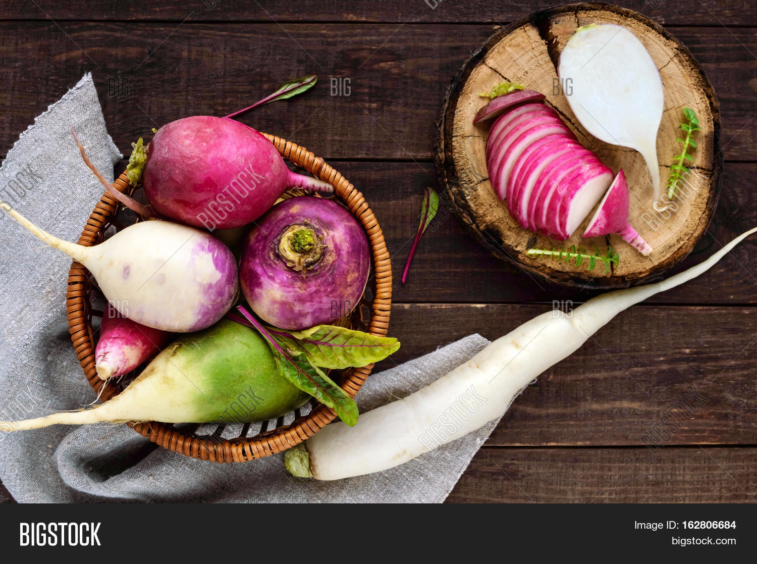 several kinds of radish (daikon chinese red green) on a wooden