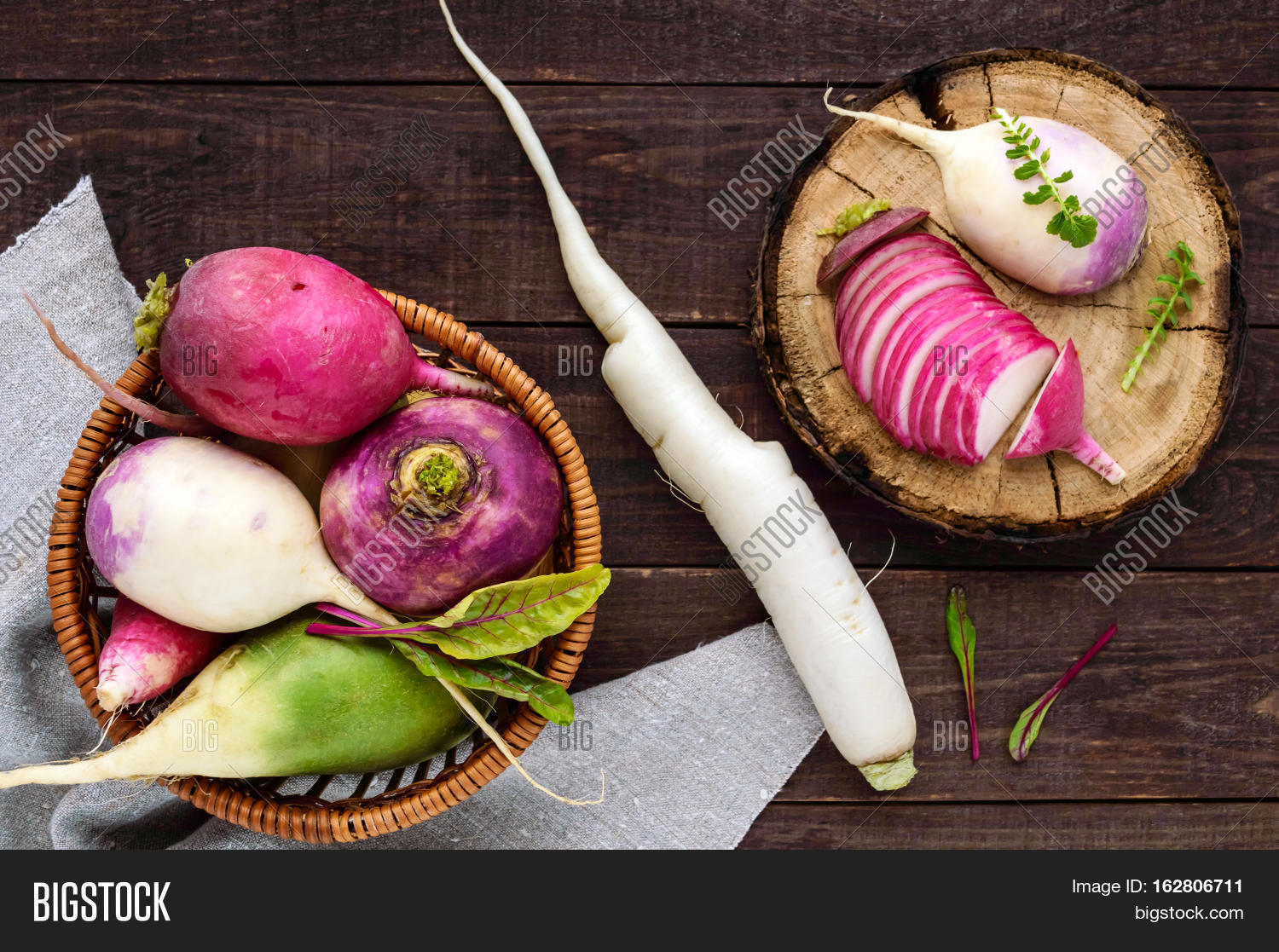 several kinds of radish (daikon chinese red green) on a wooden