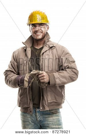 young dirty worker man with hard hat helmet .