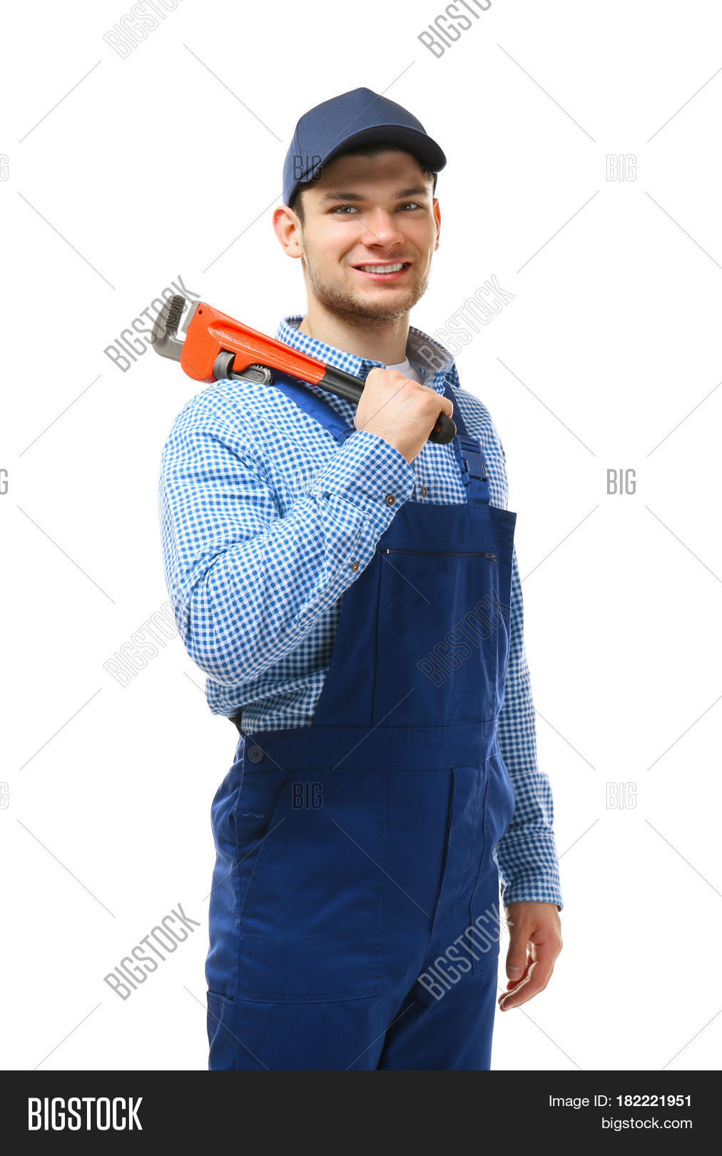 young plumber holding pipe wrench isolated on white