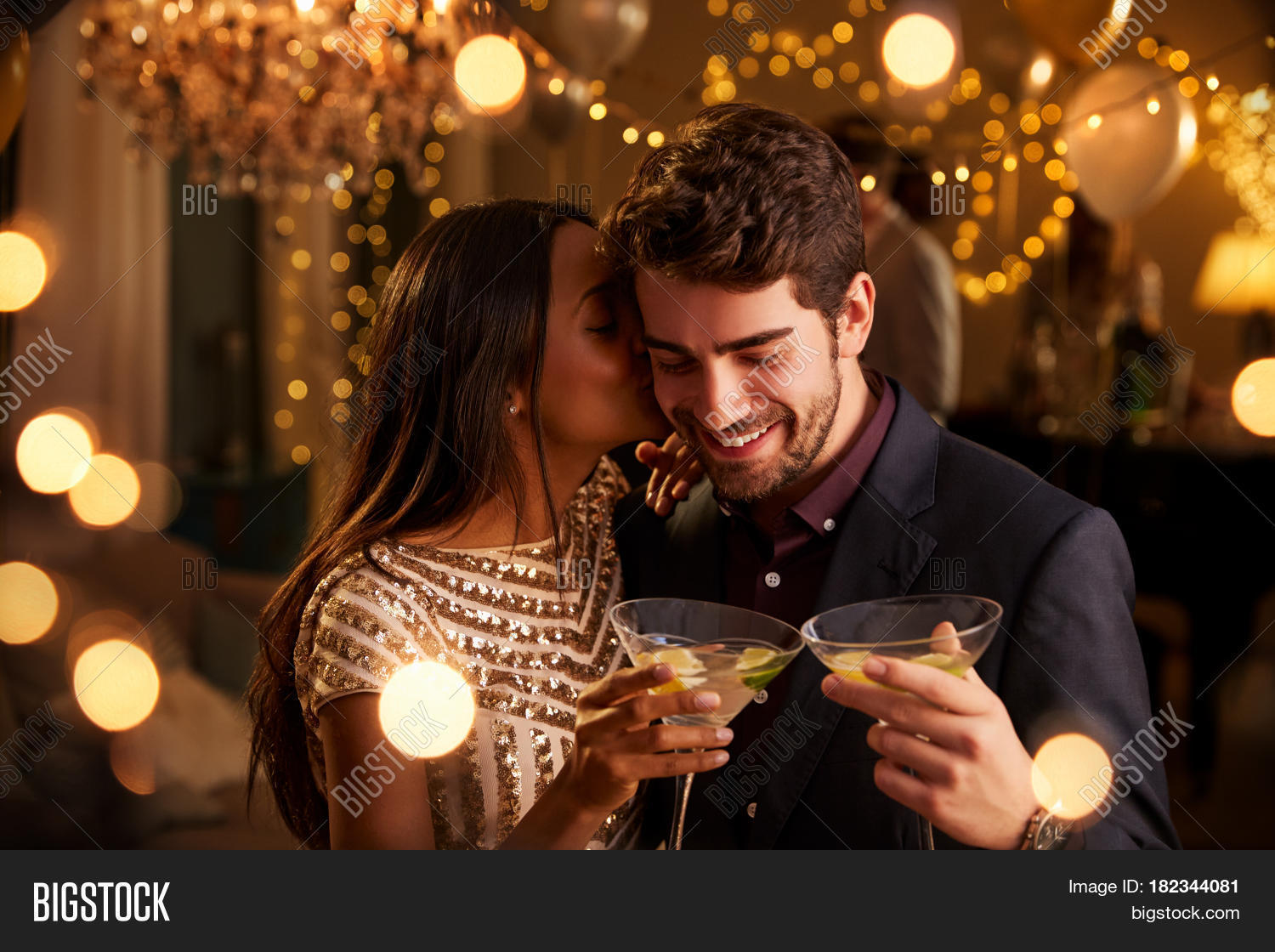 romantic couple enjoying cocktail party together