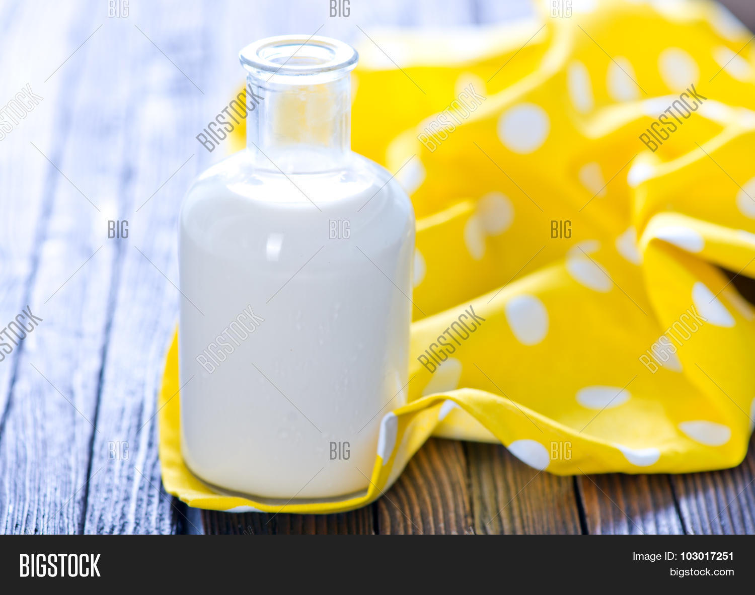 fresh milk in bottle and on a table