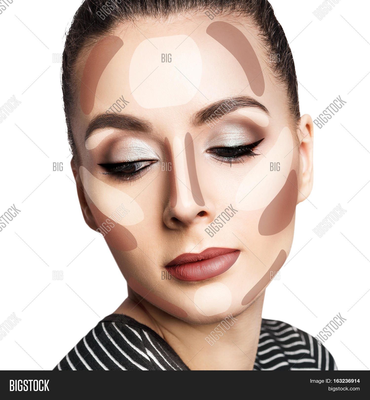 young womans face with contouring makeup.