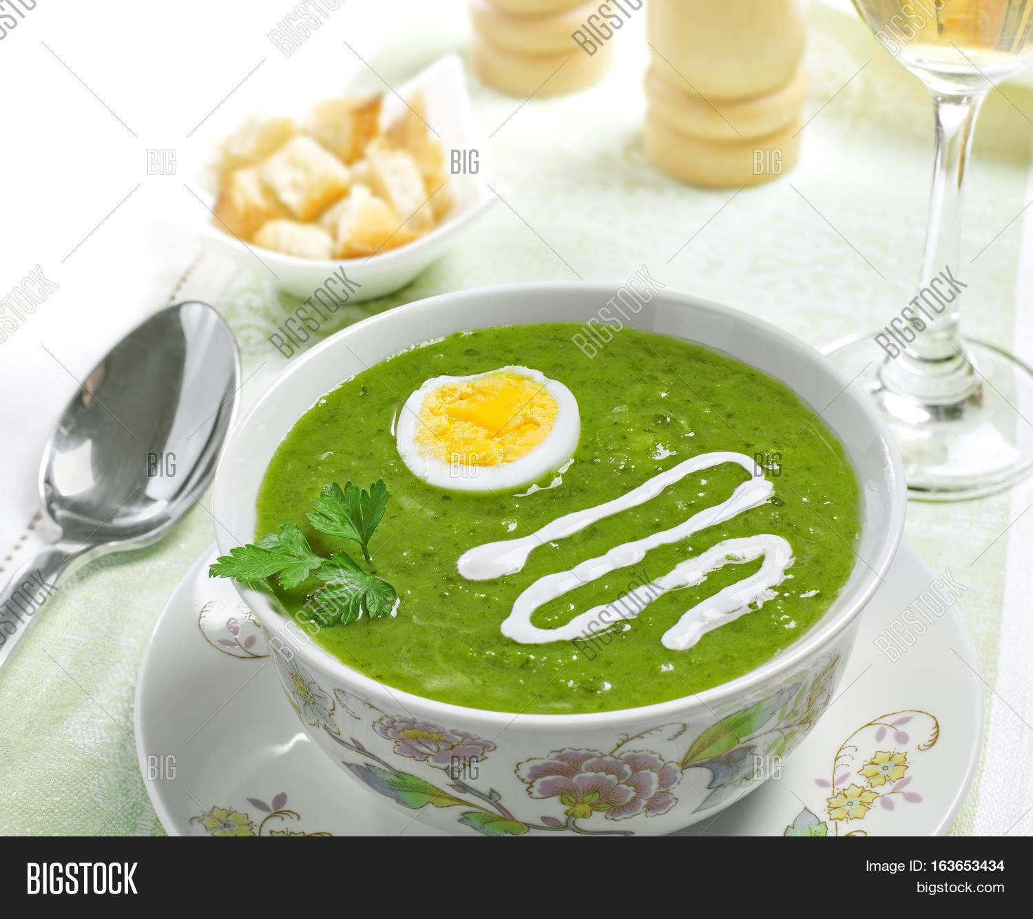 cream soup with egg sour cream and wine on the table studio shot